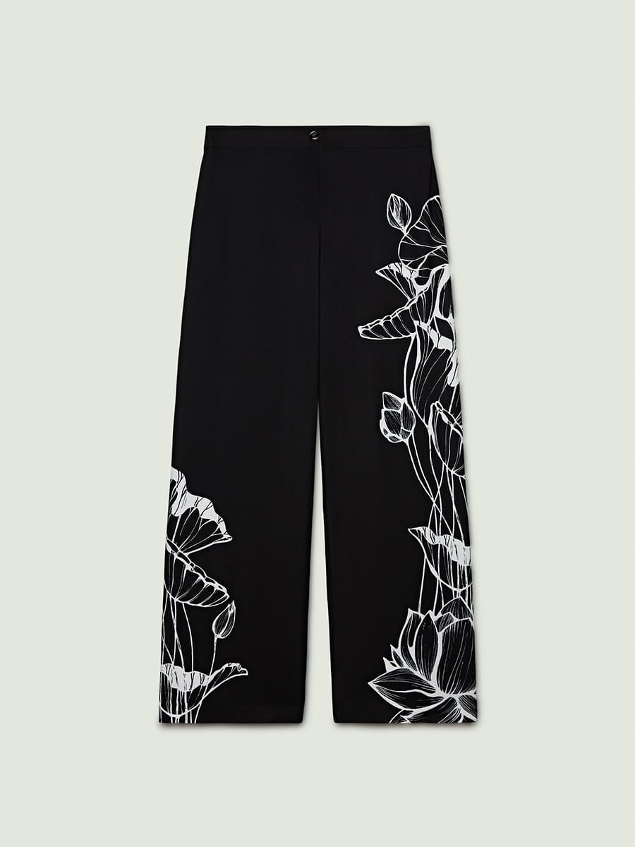 Pantalone nero fiore bianco stiizzato